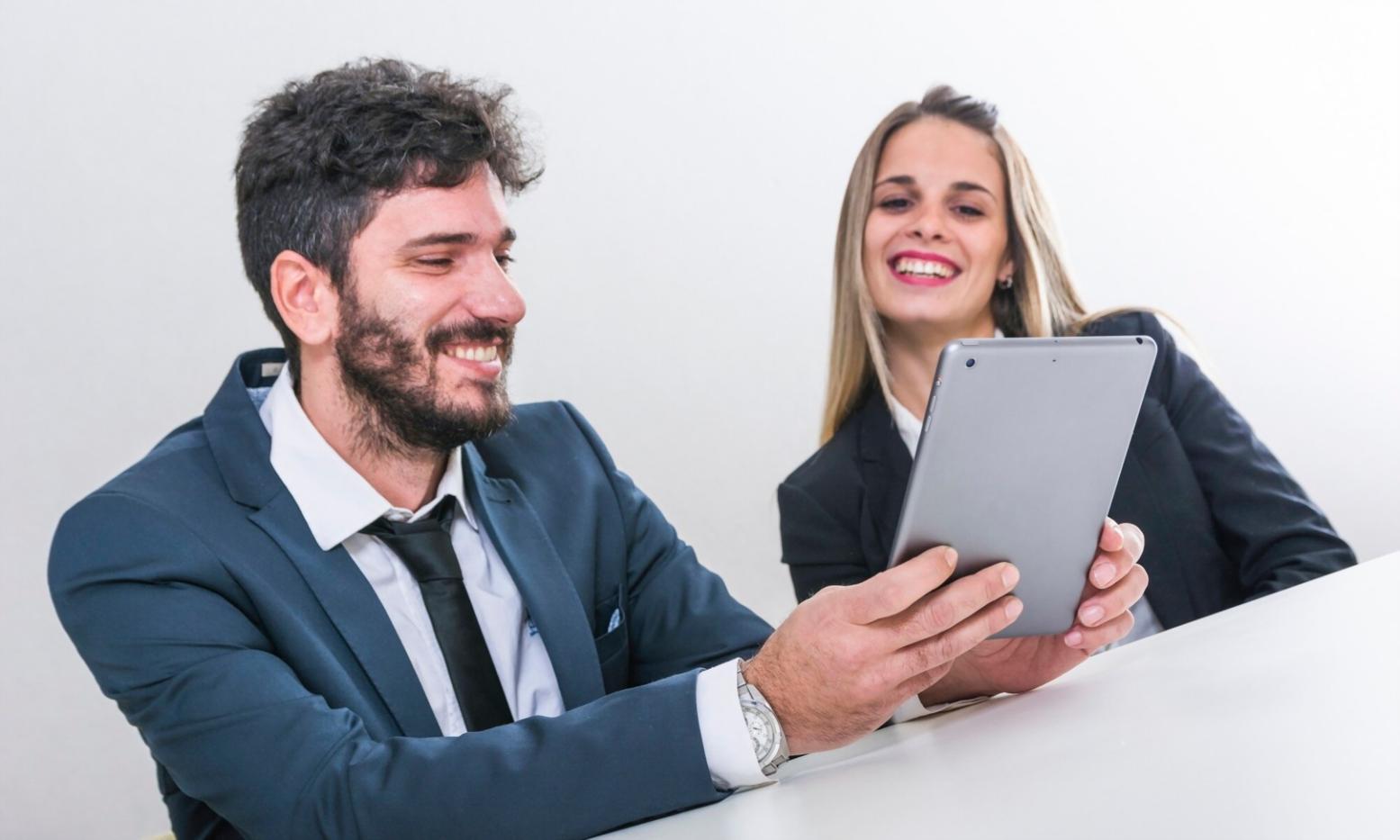 Financial analysts working on scenario modeling in modern office environment